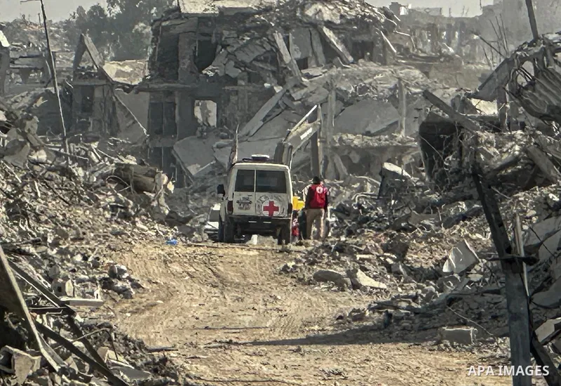 Machinery is working alongside a Red Cross vehicle in the area known as the "Yellow Line," to which Israeli forces withdrew under the ceasefire, where Hamas says it is continuing to search for the bodies of prisoners cap...