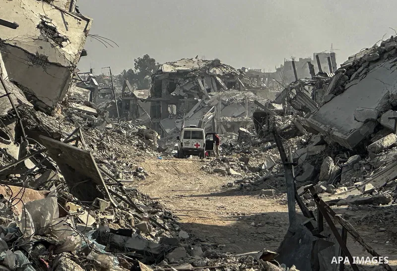 Machinery is working alongside a Red Cross vehicle in the area known as the "Yellow Line," to which Israeli forces withdrew under the ceasefire, where Hamas says it is continuing to search for the bodies of prisoners cap...
