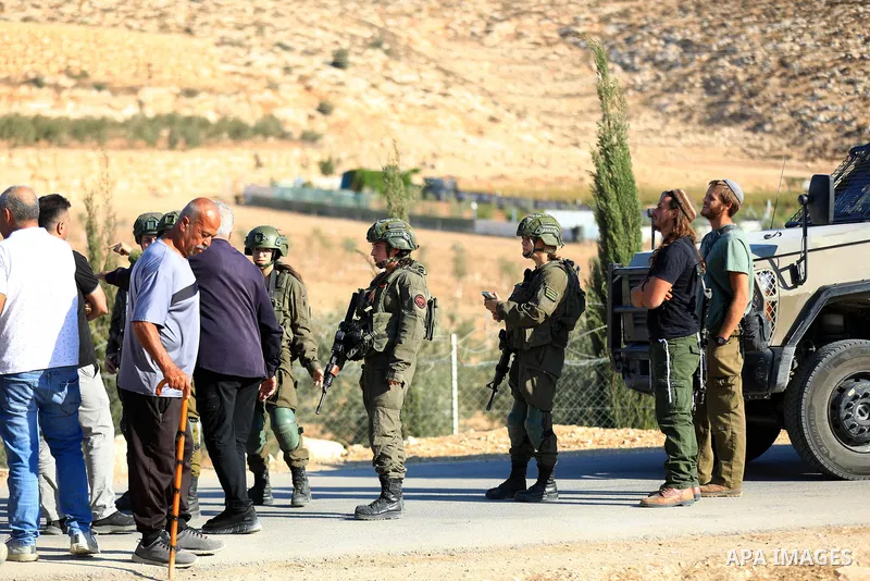 The Israeli army intervenes with tear gas and sound bombs against Palestinian farmers trying to access their own land in the al-Jalatiya area of Idhna, west of Hebron in the West Bank on November 3, 2025. Soldiers disper...