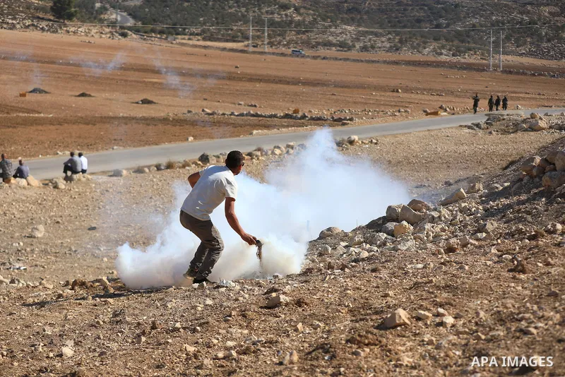 The Israeli army intervenes with tear gas and sound bombs against Palestinian farmers trying to access their own land in the al-Jalatiya area of Idhna, west of Hebron in the West Bank on November 3, 2025. Soldiers disper...