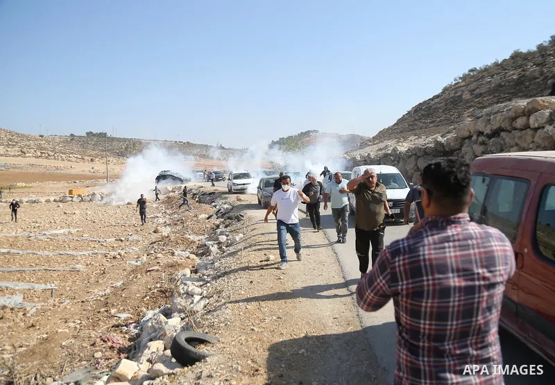 The Israeli army intervenes with tear gas and sound bombs against Palestinian farmers trying to access their own land in the al-Jalatiya area of Idhna, west of Hebron in the West Bank on November 3, 2025. Soldiers disper...