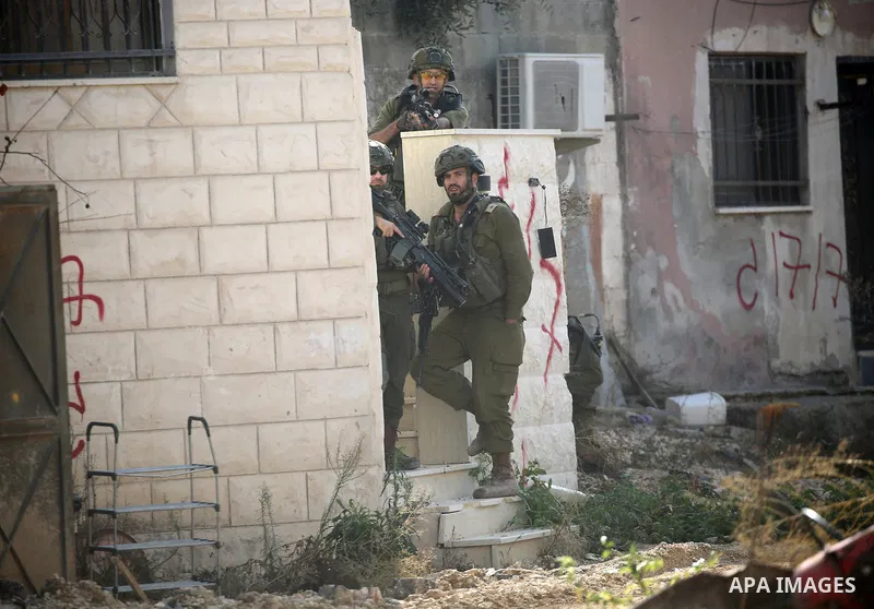 Displaced Palestinians stage a protest at the entrance to the Nur Shams refugee camp in the West Bank, calling for their right to return to their homes in Tulkarm. Israeli forces block the demonstration and detain severa...