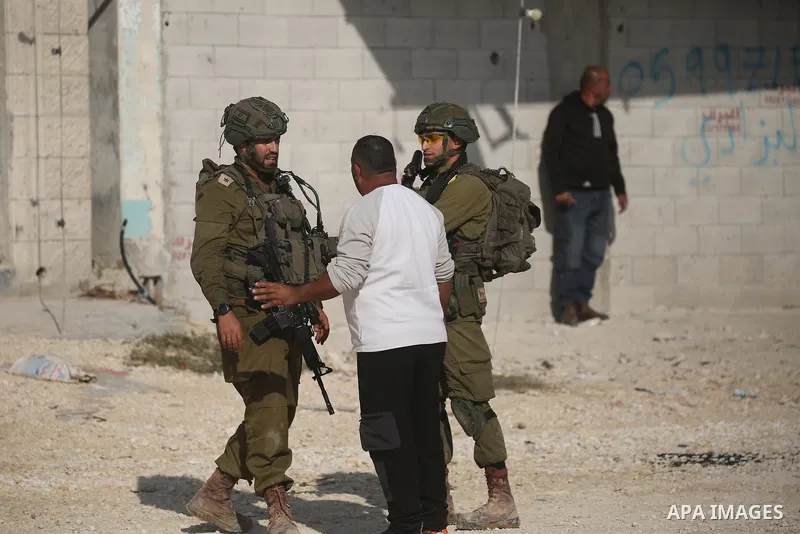 Displaced Palestinians stage a protest at the entrance to the Nur Shams refugee camp in the West Bank, calling for their right to return to their homes in Tulkarm. Israeli forces block the demonstration and detain severa...