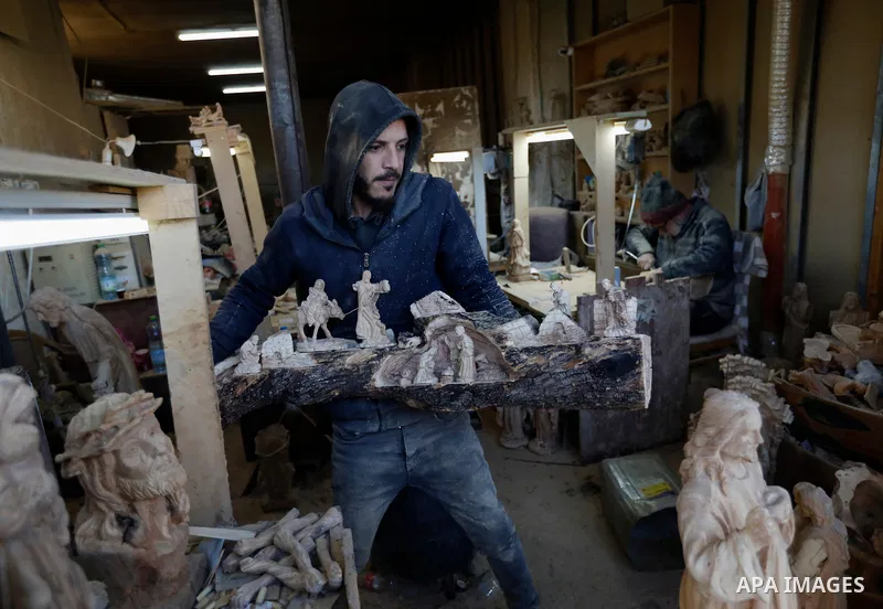 Palestinians in Bethlehem continue to carve olive wood into artistic pieces and a variety of gifts, including religious sculptures, traditional decorations, and souvenirs, in preparation for Christmas. Olive wood carving...