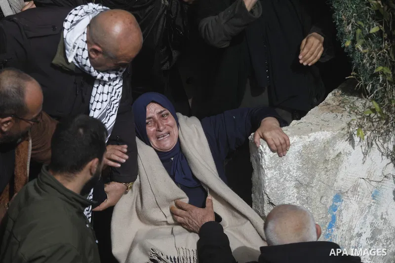 Palestinians mourn the death of 20-year-old Mohammed Najeh Nasrallah, who was killed by Israeli army fire yesterday during an Israeli raid on the town of Al-Dhahiriya, south of Hebron in the West Bank. January 28, 2026....