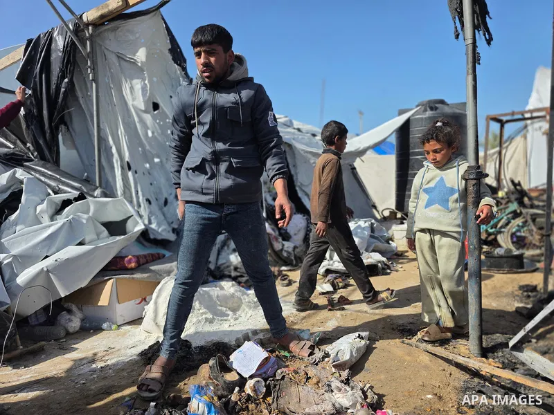 Palestinians inspect the site of an Israeli strike on tents on Saturday, in Khan Younis, in the southern Gaza Strip, January 31, 2026. Photo by Tariq Mohammad\ APA Images