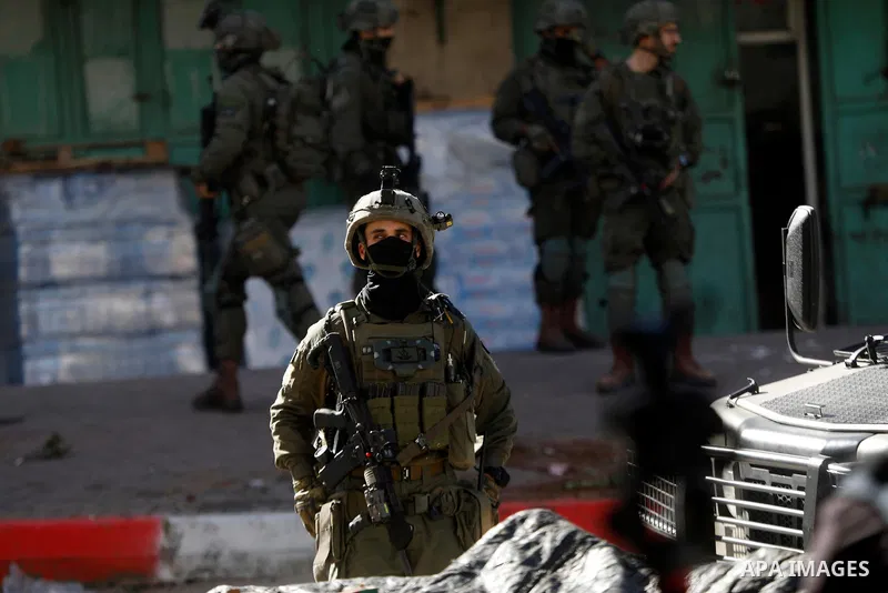 Israeli forces carry out a raid on the city of Hebron, the West Bank on January 31, 2026. During the raid, Israeli military bulldozers placed concrete blocks on many streets across the city, restricting the movement of P...