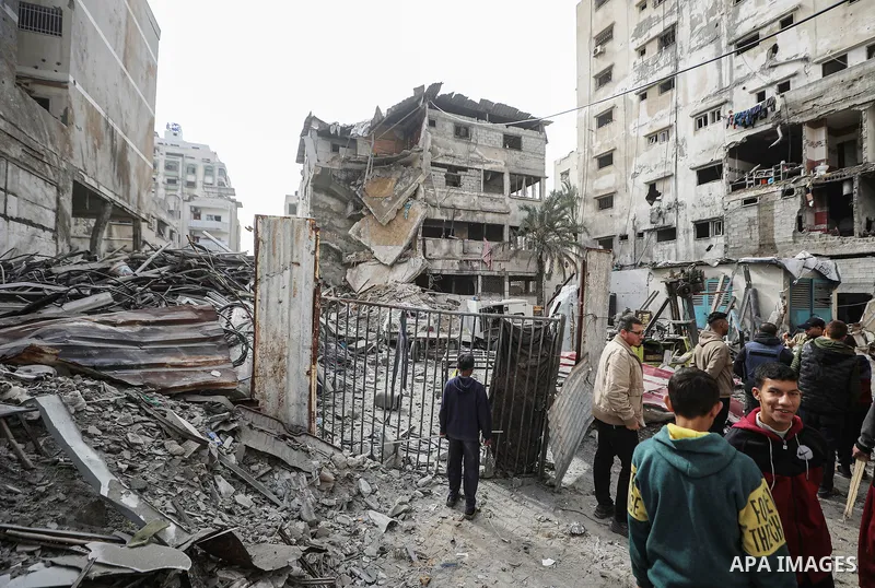 Palestinians inspect the damaged and largely destroyed building after the Israeli army targeted it in Nasser neighborhood of Gaza City, Gaza on January 31, 2026. At least 29 Palestinians were killed at dawn on Saturday i...
