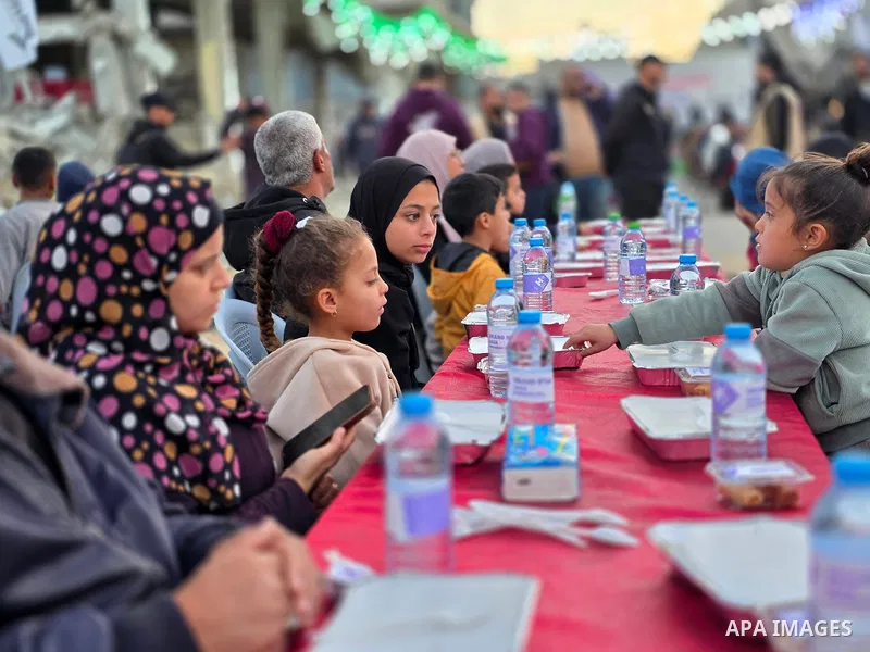 Hundreds of Palestinian families break the fast amid the devastation in the Al-Amal neighborhood, north of Khan Younis, as part of community initiatives aimed at easing the psychological impact of Israel’s ongoing war on...