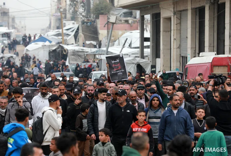 Palestinian demonstrators march through the Gaza City on April 1, 2026, during a protest against the Israeli parliament's approval of a new death penalty bill for Palestinians convicted of deadly attacks. The bill would...