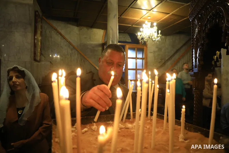 Orthodox Christians residing in Gaza City, Palestine, attend a mass at the Church of Saint Porphyrius to celebrate Palm Sunday, which commemorates Jesus' entry into Jerusalem and the people's greeting of him with palm br...