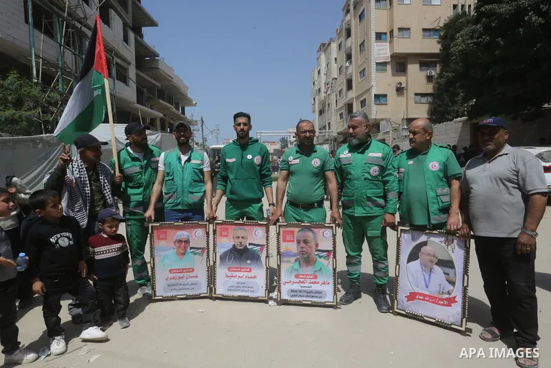 Palestinians participate in a sit-in in front of the International Committee of the Red Cross headquarters in Gaza City, commemorating Palestinian Prisoners' Day and rejecting proposed laws concerning the death penalty f...