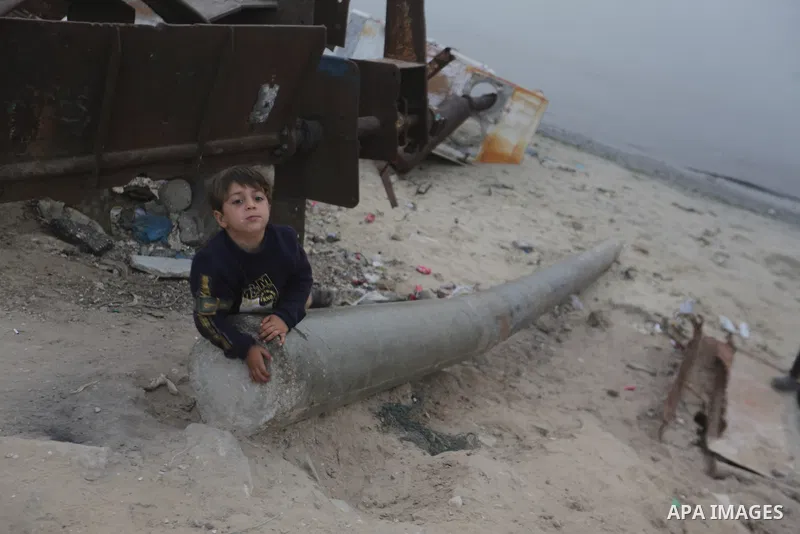 Palestinian children spend time on a beach in Gaza City, seeking respite from the heat and the pressures of daily life, as residents of the Gaza Strip face dire humanitarian conditions due to the ongoing war. Gaza City,...