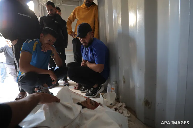 The body of a citizen and three injuries, including children, arrived at Al-Awda Hospital in Nuseirat camp, as a result of an Israeli attack north of the entrance to Al-Bureij in the central Gaza Strip, April 19, 2026. P...