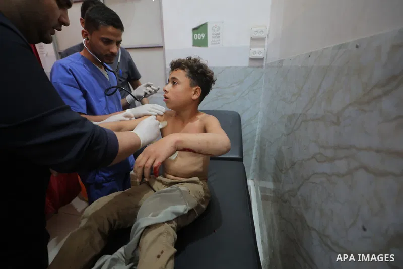 The body of a citizen and three injuries, including children, arrived at Al-Awda Hospital in Nuseirat camp, as a result of an Israeli attack north of the entrance to Al-Bureij in the central Gaza Strip, April 19, 2026. P...