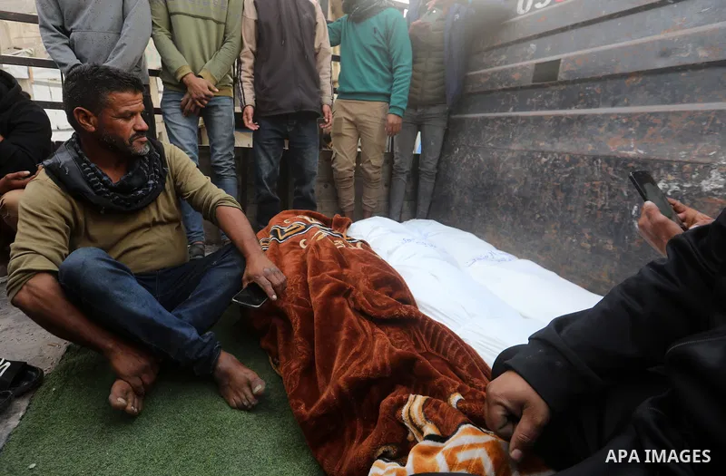 Mourners gather to bid farewell to the bodies of three Palestinians at al-Shifa Hospital in Gaza City, on April 30, 2026. The three were killed and others were wounded in an Israeli airstrike that targeted a group of civ...