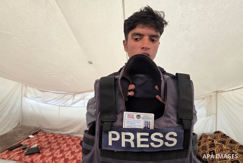 Family members of Palestinian journalist Hossam Al-Masri remember his life and work inside the tent where they are displaced in Khan Younis, southern Gaza Strip, on May 3, 2026, marking World Press Freedom Day. Al-Masri...