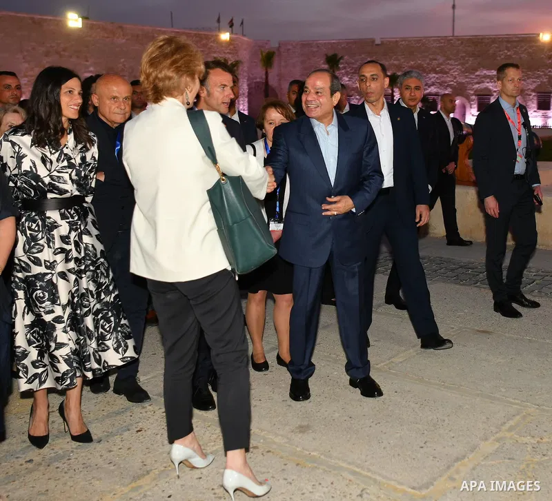 Egyptian President Abdel Fattah al-Sisi and French President Emmanuel Macron tour the Alexandria waterfront in Alexandria, Egypt, on May 09, 2026, accompanied by heads of delegations participating in the inauguration of...