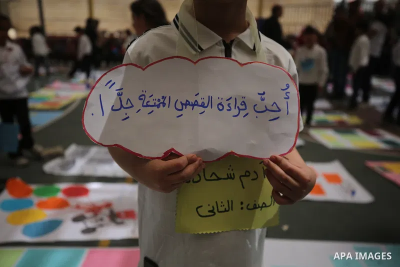 Palestinian Muslim and Christian children take part in a reading exhibition inside the Holy Family Catholic Church in the al-Zeitoun neighborhood of Gaza City on May 11, 2026, following months of education and psychologi...