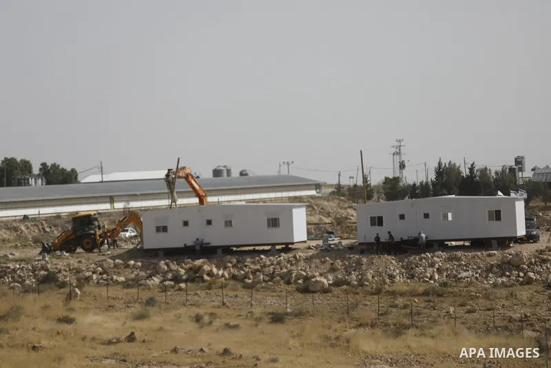 Israeli settlers continue expanding a recently established settlement outpost in the village of Umm al-Kheir in the Masafer Yatta area, south of Hebron in the occupied West Bank, on May 20, 2026. Settlers, under the prot...