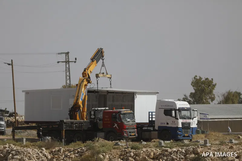Israeli settlers continue expanding a recently established settlement outpost in the village of Umm al-Kheir in the Masafer Yatta area, south of Hebron in the occupied West Bank, on May 20, 2026. Settlers, under the prot...
