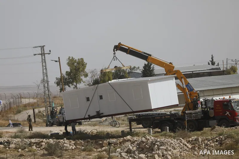 Israeli settlers continue expanding a recently established settlement outpost in the village of Umm al-Kheir in the Masafer Yatta area, south of Hebron in the occupied West Bank, on May 20, 2026. Settlers, under the prot...