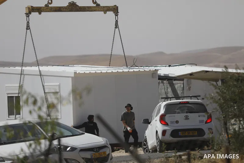 Israeli settlers continue expanding a recently established settlement outpost in the village of Umm al-Kheir in the Masafer Yatta area, south of Hebron in the occupied West Bank, on May 20, 2026. Settlers, under the prot...