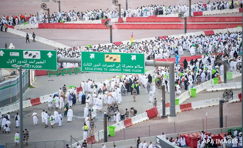 Muslim pilgrims walk on the first day of the symbolic stoning ritual during the annual Hajj pilgrimage in Mina, Saudi Arabia, on May 27, 2026. The ritual, known as the stoning of the devil, is one of the main rites of Ha...