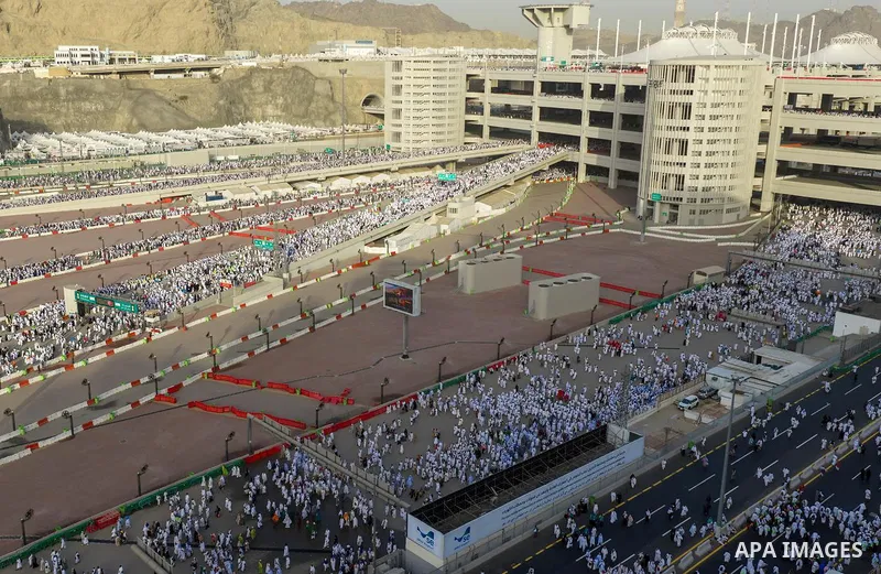 Muslim pilgrims walk on the first day of the symbolic stoning ritual during the annual Hajj pilgrimage in Mina, Saudi Arabia, on May 27, 2026. The ritual, known as the stoning of the devil, is one of the main rites of Ha...