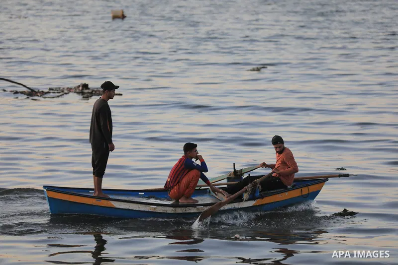 Palestinians gather along the beach at the Gaza City on June 5, 2026, during hot weather conditions. Despite a truce technically in effect since October 2025, daily violence has continued across the Gaza Strip, more than...