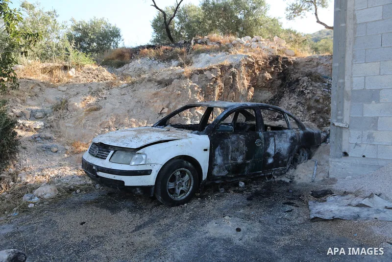 Palestinians inspect a burned house and vehicle following an attack by Israeli settlers on Palestinian homes, vehicles and property in the village of Beit Ammar, north of Nablus in the occupied West Bank, on June 9, 2026...
