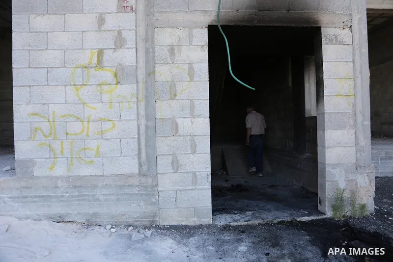 Palestinians inspect a burned house and vehicle following an attack by Israeli settlers on Palestinian homes, vehicles and property in the village of Beit Ammar, north of Nablus in the occupied West Bank, on June 9, 2026...