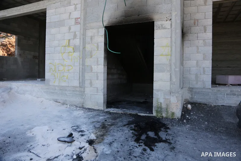Palestinians inspect a burned house and vehicle following an attack by Israeli settlers on Palestinian homes, vehicles and property in the village of Beit Ammar, north of Nablus in the occupied West Bank, on June 9, 2026...