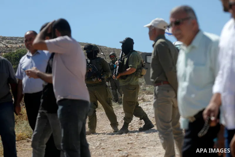 Palestinians take part in a protest against plans to confiscate land for settlement expansion in Khirbet Humsa, west of Hebron in the occupied West Bank, on June 9, 2026. Local sources said Israeli forces dispersed the d...
