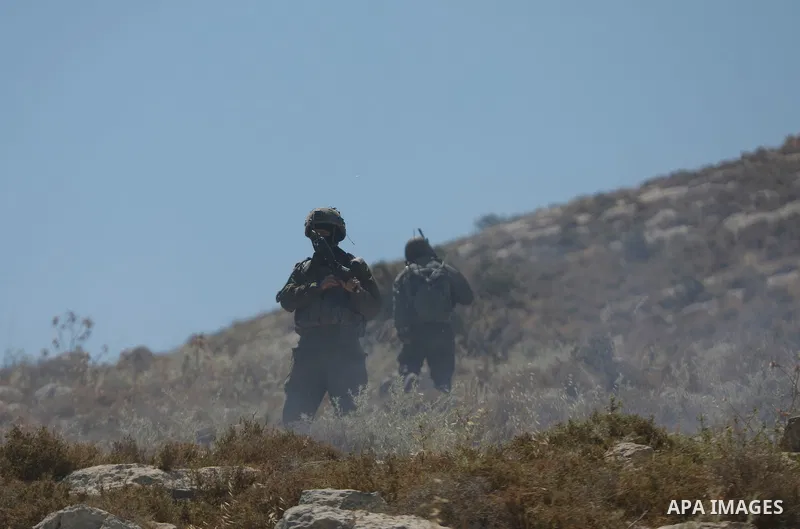 Palestinians take part in a protest against plans to confiscate land for settlement expansion in Khirbet Humsa, west of Hebron in the occupied West Bank, on June 9, 2026. Local sources said Israeli forces dispersed the d...