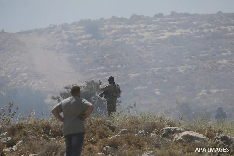Palestinians take part in a protest against plans to confiscate land for settlement expansion in Khirbet Humsa, west of Hebron in the occupied West Bank, on June 9, 2026. Local sources said Israeli forces dispersed the d...
