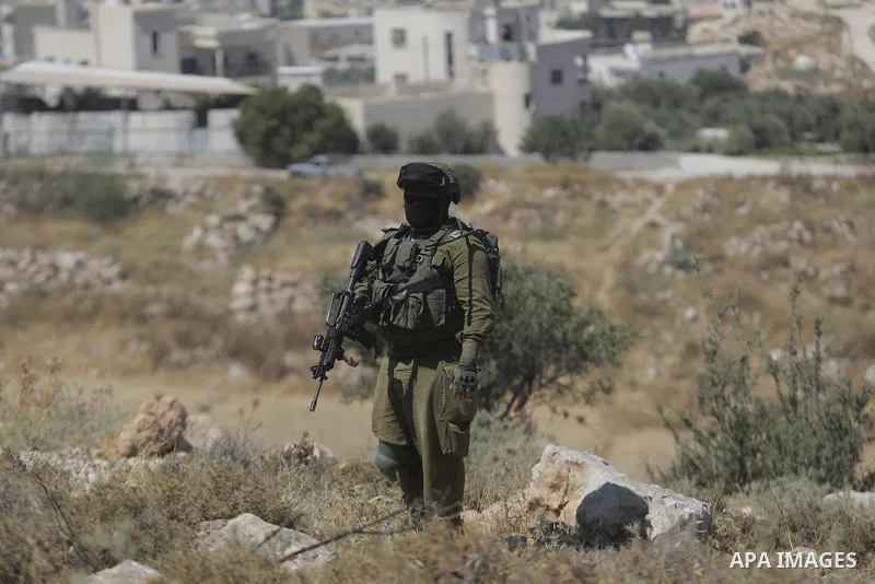 Palestinians take part in a protest against plans to confiscate land for settlement expansion in Khirbet Humsa, west of Hebron in the occupied West Bank, on June 9, 2026. Local sources said Israeli forces dispersed the d...