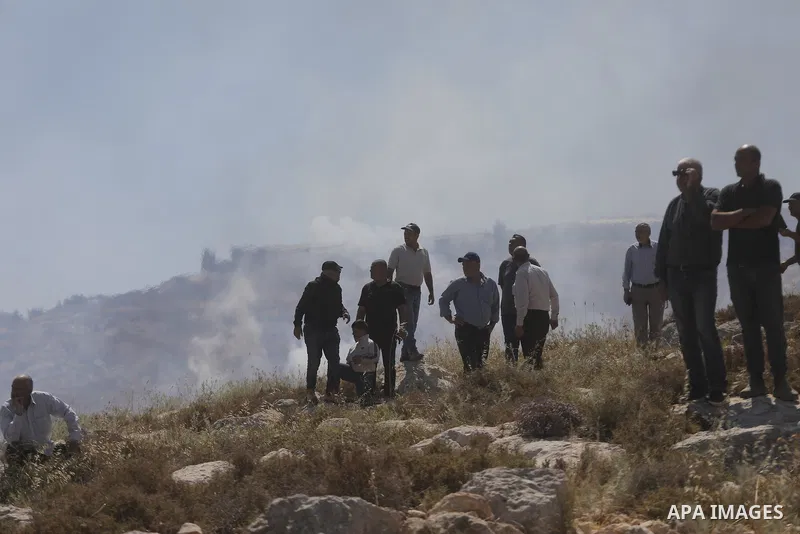 Palestinians take part in a protest against plans to confiscate land for settlement expansion in Khirbet Humsa, west of Hebron in the occupied West Bank, on June 9, 2026. Local sources said Israeli forces dispersed the d...