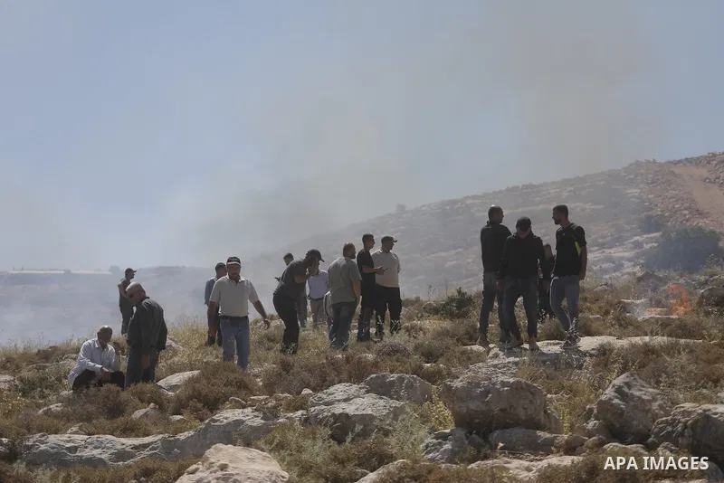 Palestinians take part in a protest against plans to confiscate land for settlement expansion in Khirbet Humsa, west of Hebron in the occupied West Bank, on June 9, 2026. Local sources said Israeli forces dispersed the d...