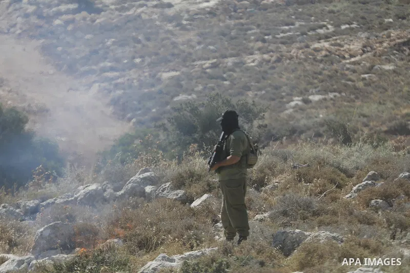 Palestinians take part in a protest against plans to confiscate land for settlement expansion in Khirbet Humsa, west of Hebron in the occupied West Bank, on June 9, 2026. Local sources said Israeli forces dispersed the d...