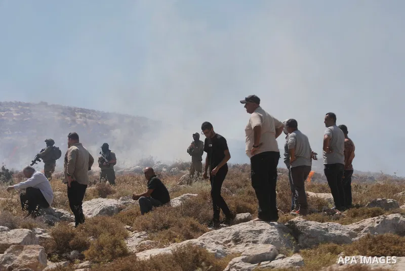 Palestinians take part in a protest against plans to confiscate land for settlement expansion in Khirbet Humsa, west of Hebron in the occupied West Bank, on June 9, 2026. Local sources said Israeli forces dispersed the d...