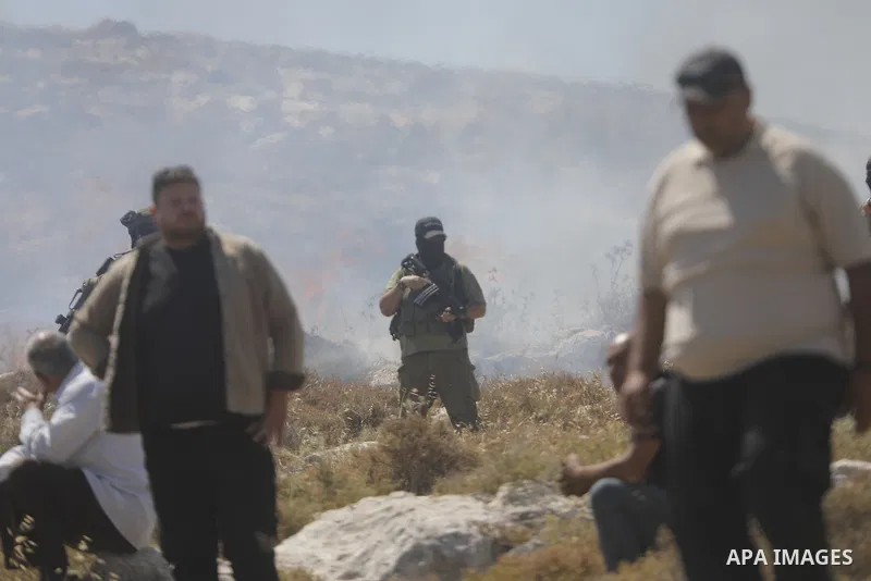 Palestinians take part in a protest against plans to confiscate land for settlement expansion in Khirbet Humsa, west of Hebron in the occupied West Bank, on June 9, 2026. Local sources said Israeli forces dispersed the d...