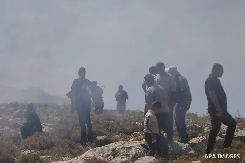 Palestinians take part in a protest against plans to confiscate land for settlement expansion in Khirbet Humsa, west of Hebron in the occupied West Bank, on June 9, 2026. Local sources said Israeli forces dispersed the d...