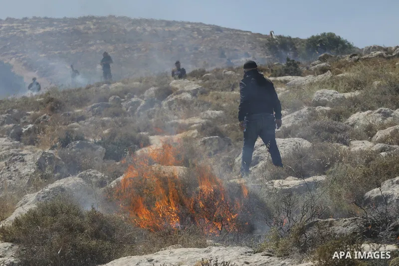 Palestinians take part in a protest against plans to confiscate land for settlement expansion in Khirbet Humsa, west of Hebron in the occupied West Bank, on June 9, 2026. Local sources said Israeli forces dispersed the d...