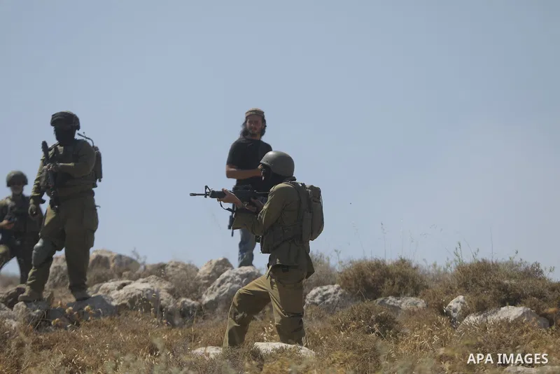Palestinians take part in a protest against plans to confiscate land for settlement expansion in Khirbet Humsa, west of Hebron in the occupied West Bank, on June 9, 2026. Local sources said Israeli forces dispersed the d...