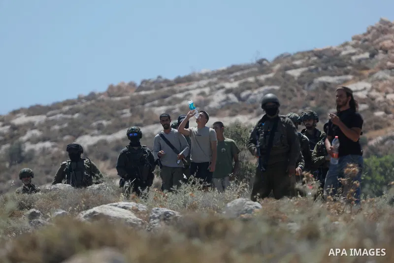 Palestinians take part in a protest against plans to confiscate land for settlement expansion in Khirbet Humsa, west of Hebron in the occupied West Bank, on June 9, 2026. Local sources said Israeli forces dispersed the d...