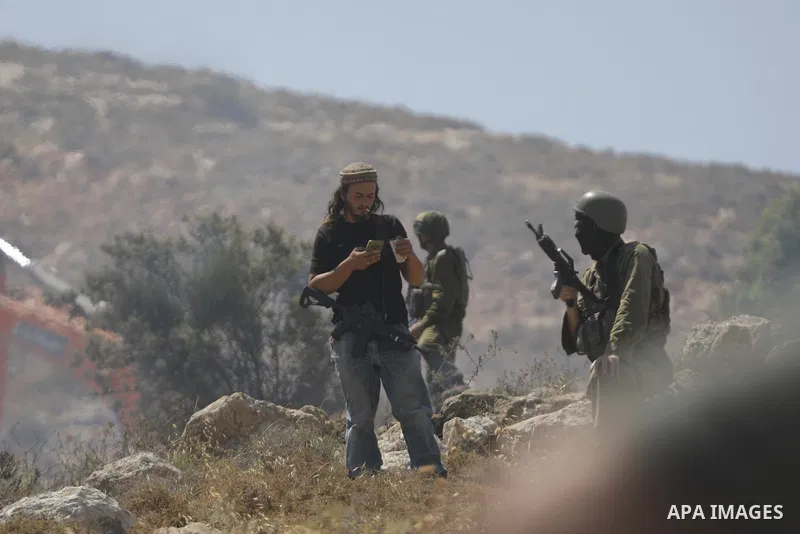 Palestinians take part in a protest against plans to confiscate land for settlement expansion in Khirbet Humsa, west of Hebron in the occupied West Bank, on June 9, 2026. Local sources said Israeli forces dispersed the d...