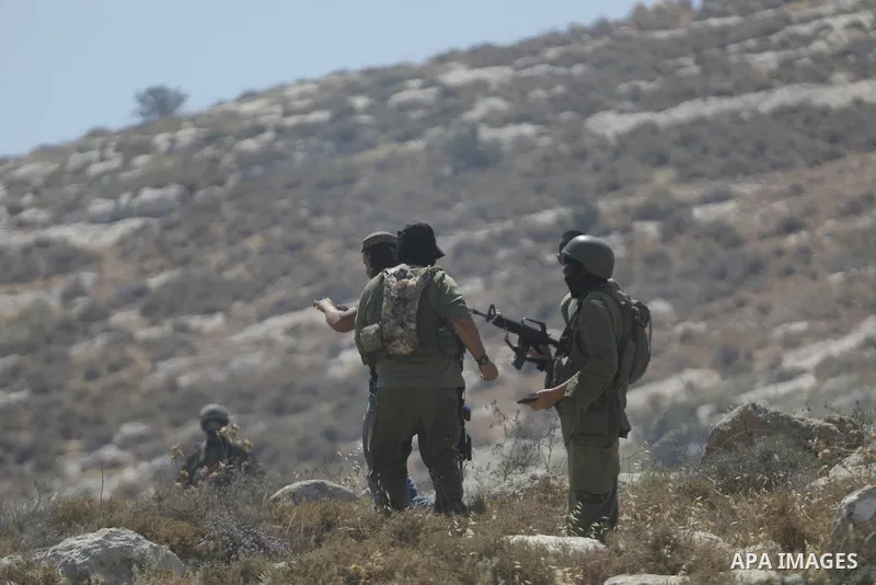 Palestinians take part in a protest against plans to confiscate land for settlement expansion in Khirbet Humsa, west of Hebron in the occupied West Bank, on June 9, 2026. Local sources said Israeli forces dispersed the d...