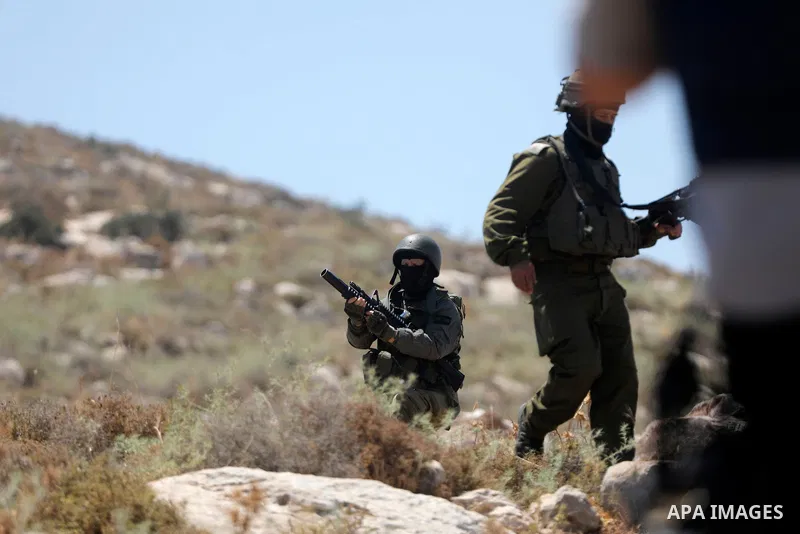 Palestinians take part in a protest against plans to confiscate land for settlement expansion in Khirbet Humsa, west of Hebron in the occupied West Bank, on June 9, 2026. Local sources said Israeli forces dispersed the d...