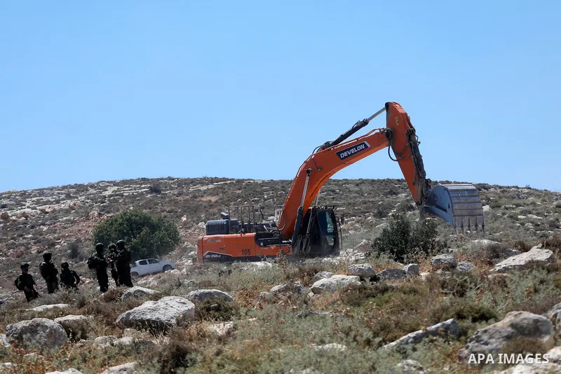 Palestinians take part in a protest against plans to confiscate land for settlement expansion in Khirbet Humsa, west of Hebron in the occupied West Bank, on June 9, 2026. Local sources said Israeli forces dispersed the d...